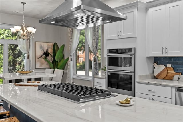 2300 Perez Way, Virginia Beach, VA 23456 - kitchen featuring island range hood, appliances with stainless steel finishes, plenty of natural light, and a chandelier