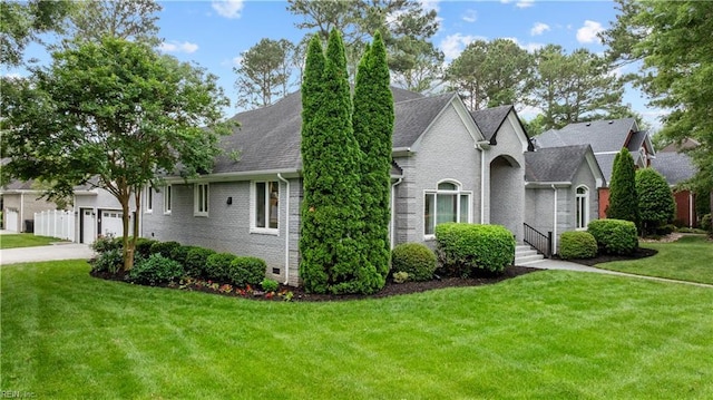 2300 Perez Way, Virginia Beach, VA 23456 - view of front of property featuring brick siding, a front lawn, a garage, a shingled roof, and concrete driveway