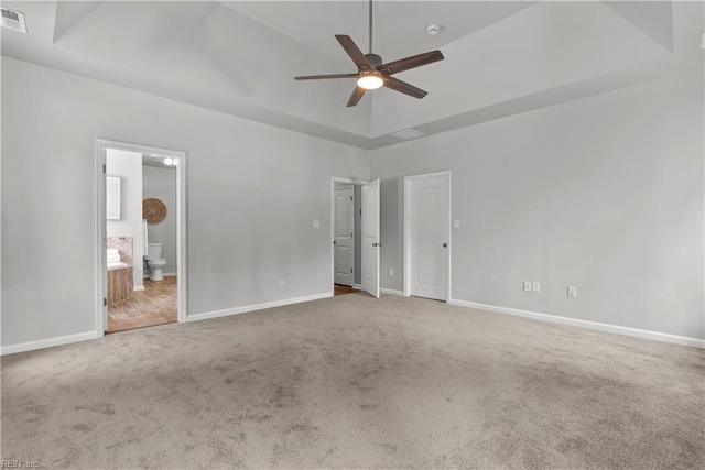 2300 Perez Way, Virginia Beach, VA 23456 - unfurnished bedroom featuring carpet, a tray ceiling, and baseboards