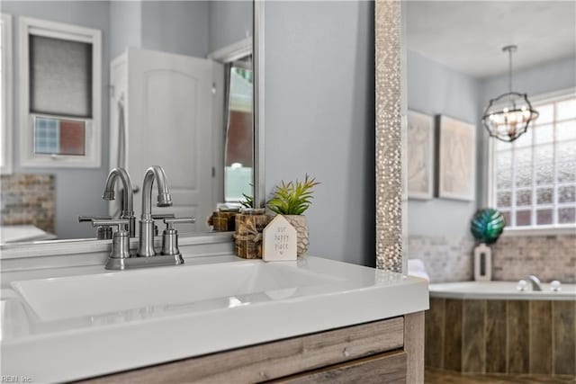 2300 Perez Way, Virginia Beach, VA 23456 - bathroom featuring a chandelier, tasteful backsplash, and vanity