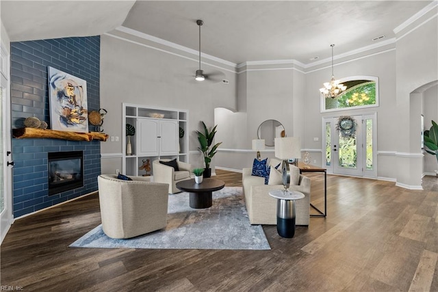 2300 Perez Way, Virginia Beach, VA 23456 - living area featuring high vaulted ceiling, a fireplace, arched walkways, ceiling fan, and a chandelier