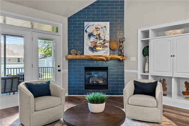 2300 Perez Way, Virginia Beach, VA 23456 - sitting room with a tiled fireplace, wood finished floors, and vaulted ceiling