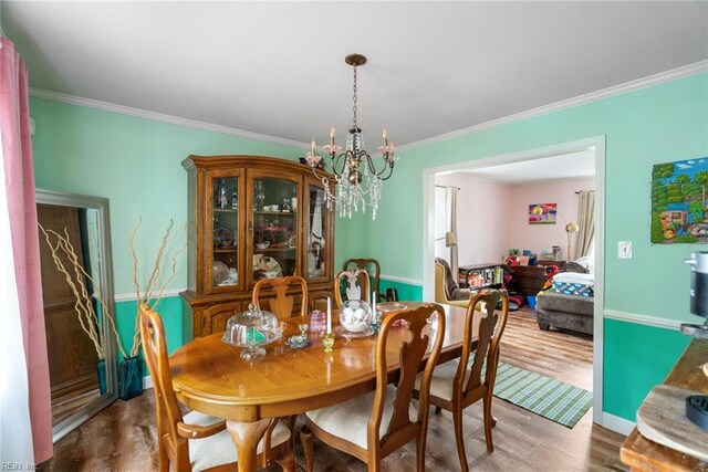 4769 Marlborough Dr, Virginia Beach, VA 23464 - dining area featuring ornamental molding, a chandelier, and wood finished floors