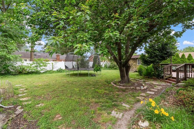 4769 Marlborough Dr, Virginia Beach, VA 23464 - view of yard featuring a trampoline and a deck