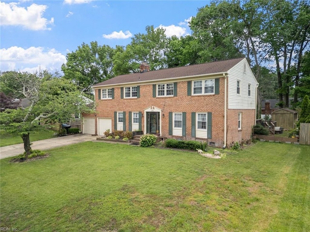 4769 Marlborough Dr, Virginia Beach, VA 23464 - colonial home with brick siding, concrete driveway, a garage, a chimney, and a front yard