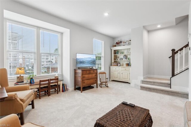 109 Big Woods Dr, Poquoson, VA 23662 - living area with light colored carpet, stairway, recessed lighting, and baseboards