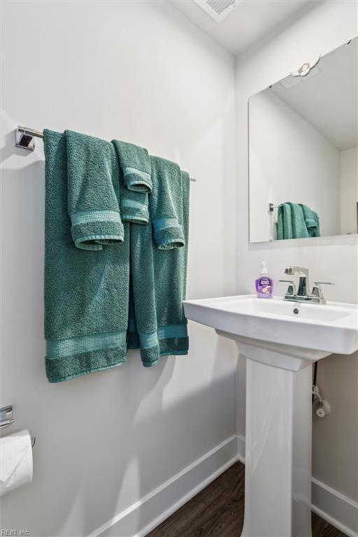 109 Big Woods Dr, Poquoson, VA 23662 - bathroom with baseboards and wood finished floors