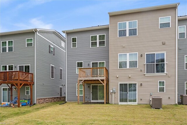 109 Big Woods Dr, Poquoson, VA 23662 - back of property with central air condition unit and a yard