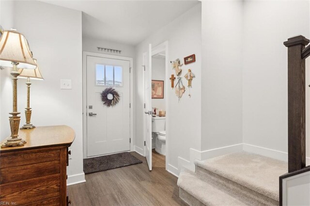 109 Big Woods Dr, Poquoson, VA 23662 - foyer entrance with wood finished floors, baseboards, and stairway