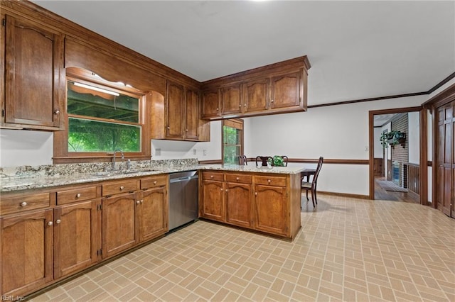 104 Beechwood Dr, Franklin, VA 23851 - kitchen featuring dishwasher, brick patterned flooring, a sink, a peninsula, and baseboards