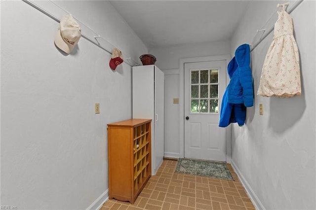 104 Beechwood Dr, Franklin, VA 23851 - doorway with brick patterned flooring and baseboards