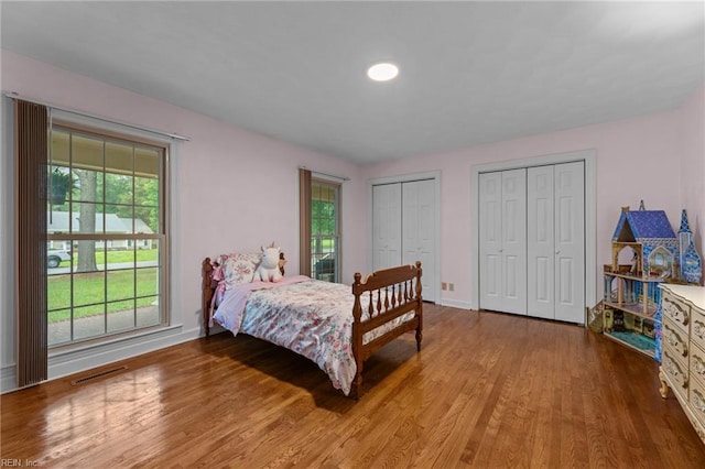 104 Beechwood Dr, Franklin, VA 23851 - bedroom with wood finished floors, multiple closets, and baseboards