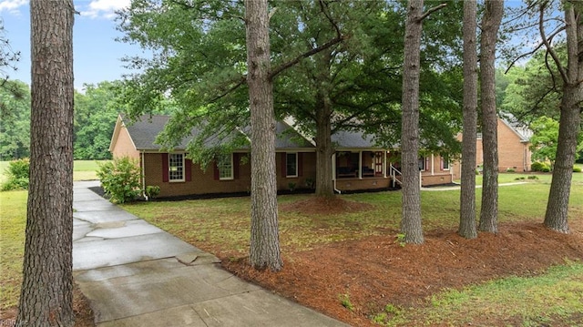 104 Beechwood Dr, Franklin, VA 23851 - single story home featuring concrete driveway, a front yard, and covered porch