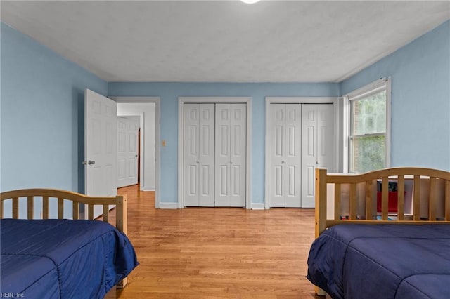 104 Beechwood Dr, Franklin, VA 23851 - bedroom featuring multiple closets, light wood finished floors, and baseboards