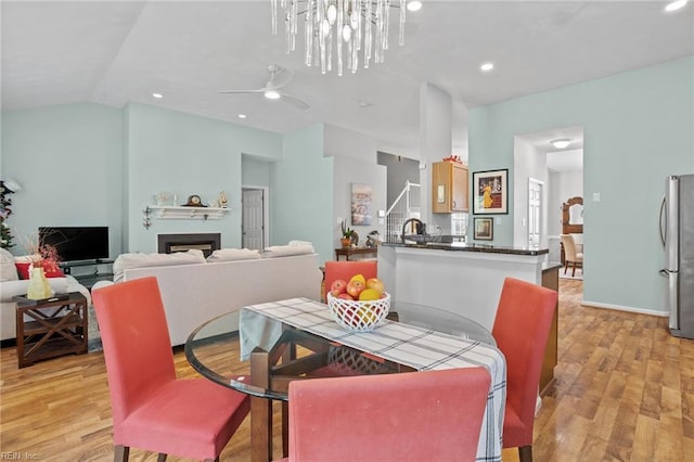 2777 Livingston Loop, Virginia Beach, VA 23456 - dining room with light wood-style floors, a fireplace, ceiling fan, lofted ceiling, and recessed lighting
