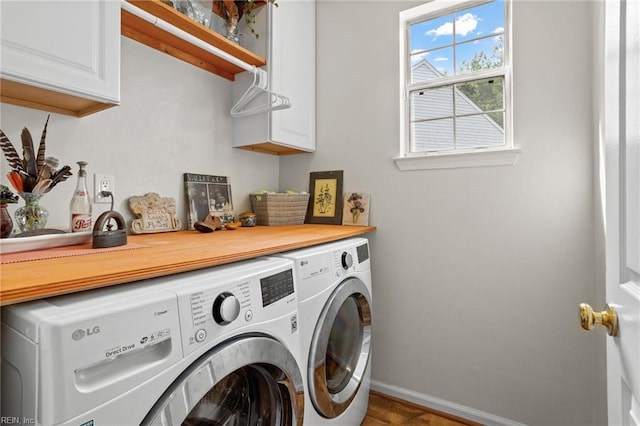 2777 Livingston Loop, Virginia Beach, VA 23456 - laundry room with cabinet space, separate washer and dryer, baseboards, and wood finished floors