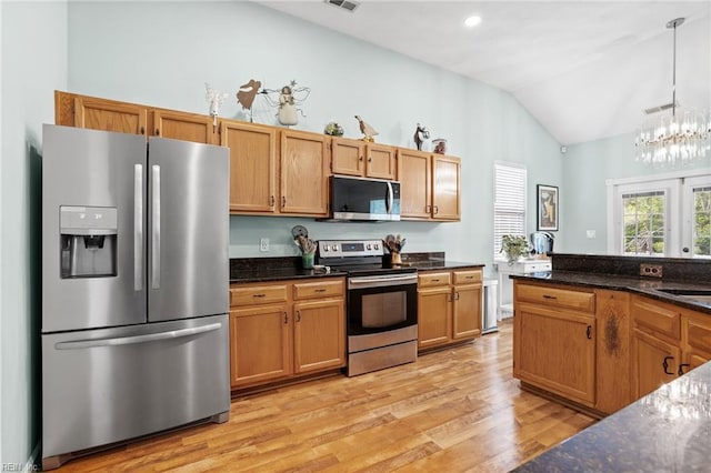 2777 Livingston Loop, Virginia Beach, VA 23456 - kitchen featuring stainless steel appliances, lofted ceiling, light wood finished floors, pendant lighting, and a chandelier