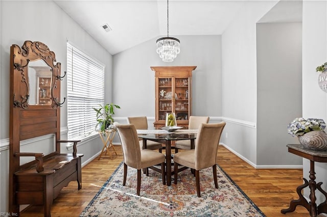 2777 Livingston Loop, Virginia Beach, VA 23456 - dining area with wood finished floors, a chandelier, lofted ceiling, and baseboards