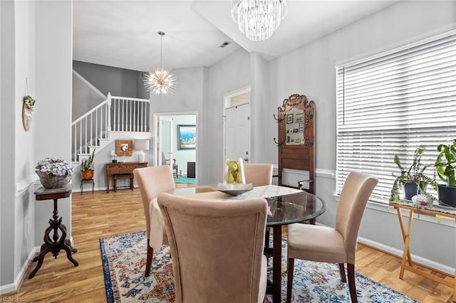 2777 Livingston Loop, Virginia Beach, VA 23456 - dining space featuring a chandelier, stairway, wood finished floors, and baseboards