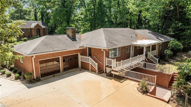1508 Reynard Rd, Suffolk, VA 23433 - view of front of property featuring brick siding, a garage, driveway, and a chimney