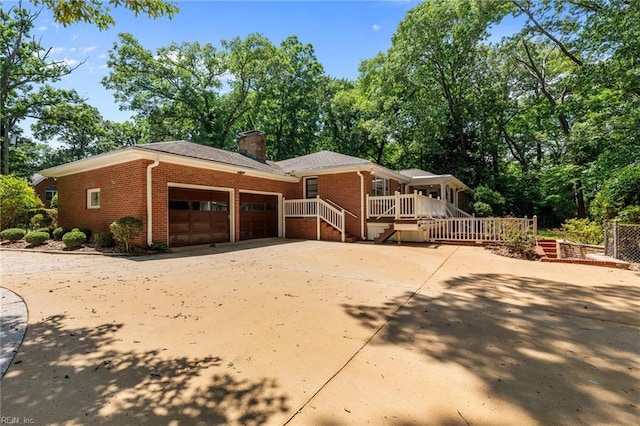 1508 Reynard Rd, Suffolk, VA 23433 - view of front facade featuring brick siding, an attached garage, a chimney, and concrete driveway