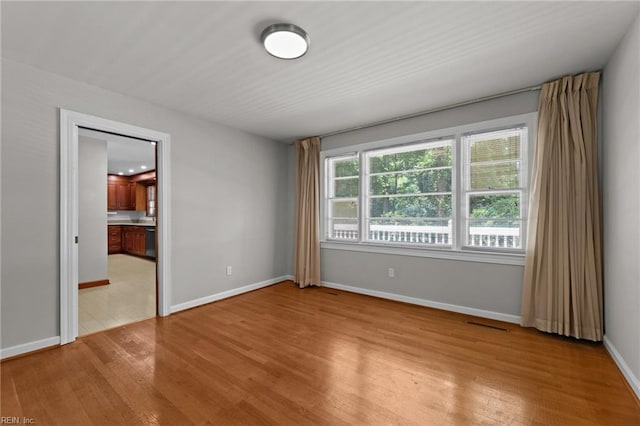 1508 Reynard Rd, Suffolk, VA 23433 - spare room featuring wood finished floors and baseboards