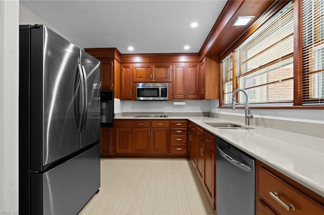 1508 Reynard Rd, Suffolk, VA 23433 - kitchen with black appliances, a sink, light countertops, and brown cabinets