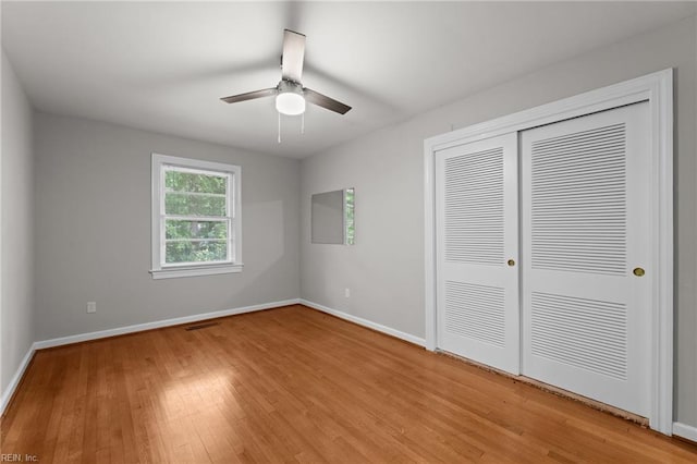 1508 Reynard Rd, Suffolk, VA 23433 - unfurnished bedroom featuring light wood finished floors, baseboards, a closet, and a ceiling fan