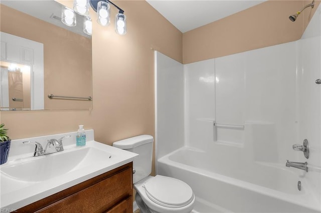 full bath with toilet, vanity, and  shower combination