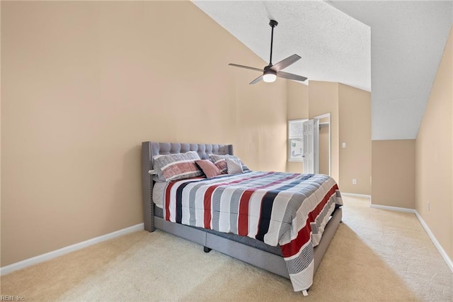 carpeted bedroom with lofted ceiling, baseboards, and a ceiling fan