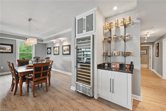 4250 Granby St Unit 106, Norfolk, VA 23504 - dining space featuring wine cooler, baseboards, light wood-type flooring, recessed lighting, and ornamental molding