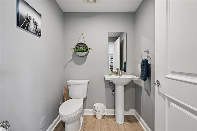 4250 Granby St Unit 106, Norfolk, VA 23504 - bathroom featuring wood finished floors, toilet, and baseboards