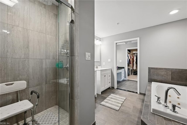 4250 Granby St Unit 106, Norfolk, VA 23504 - bathroom with a shower stall, a jetted tub, vanity, and a spacious closet