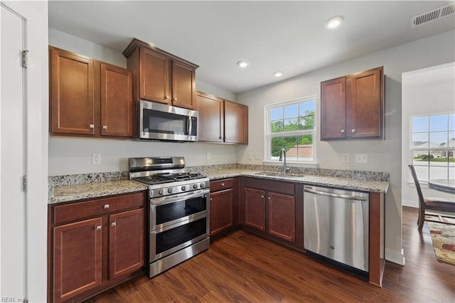 321 Windemere Rd, Newport News, VA 23602 - kitchen with stainless steel appliances, a sink, dark wood-style floors, light stone countertops, and recessed lighting
