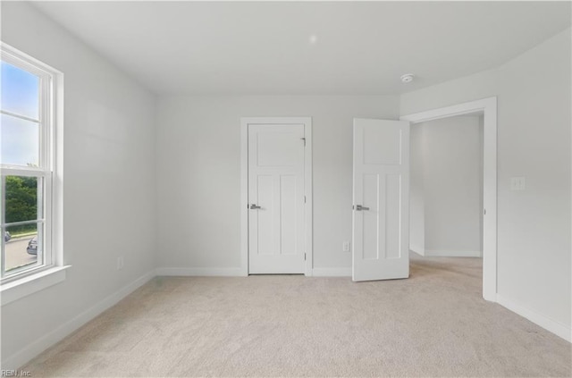 321 Windemere Rd, Newport News, VA 23602 - unfurnished bedroom featuring light colored carpet and baseboards