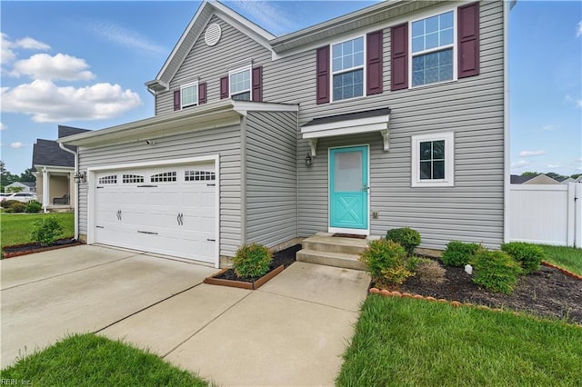 321 Windemere Rd, Newport News, VA 23602 - traditional-style house with fence, driveway, and a garage