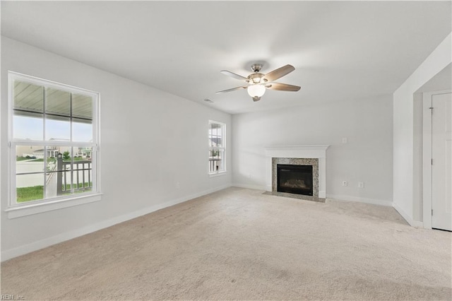 321 Windemere Rd, Newport News, VA 23602 - unfurnished living room featuring a fireplace with flush hearth, ceiling fan, light colored carpet, and baseboards