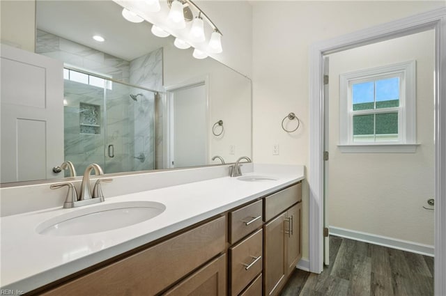 104 Pailin Creek Rd, Elizabeth City, NC 27909 - full bathroom with wood finished floors, a shower stall, double vanity, and baseboards
