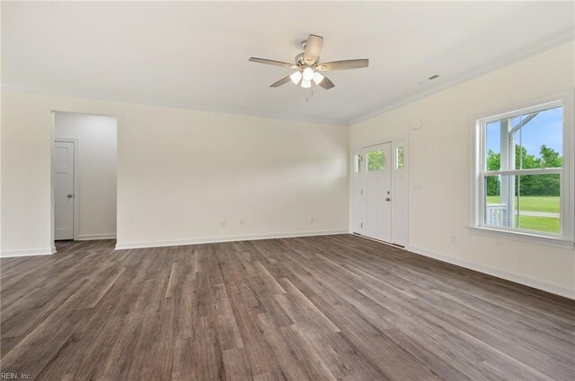 104 Pailin Creek Rd, Elizabeth City, NC 27909 - unfurnished living room featuring dark wood-type flooring, crown molding, ceiling fan, and baseboards