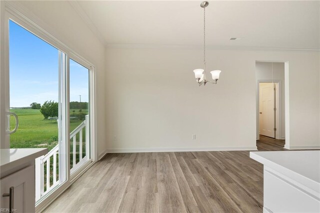 104 Pailin Creek Rd, Elizabeth City, NC 27909 - unfurnished dining area featuring ornamental molding, a chandelier, light wood-type flooring, and baseboards