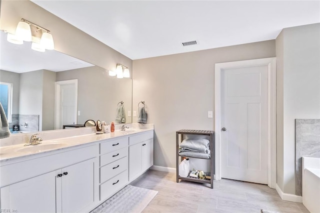 3820 Whites Lndg, Chesapeake, VA 23321 - full bath featuring a tub, baseboards, double vanity, and wood finished floors