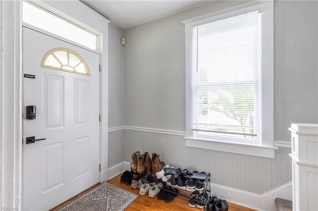 113 E Virginia Ave, Hampton, VA 23663 - entryway featuring a wainscoted wall, healthy amount of natural light, and wood finished floors