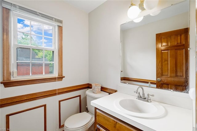 bathroom with toilet and vanity