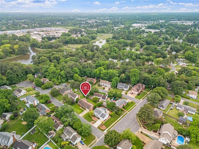 aerial perspective of suburban area featuring a large body of water