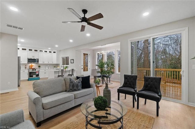 1755 Jason Ave, Norfolk, VA 23509 - living area featuring light wood finished floors, recessed lighting, a ceiling fan, and baseboards