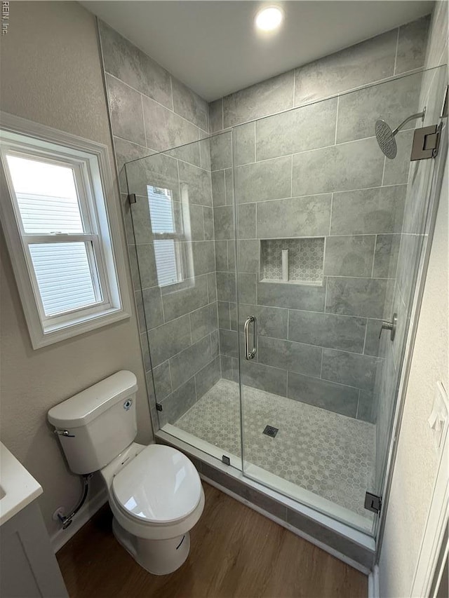 1755 Jason Ave, Norfolk, VA 23509 - bathroom featuring wood finished floors, a stall shower, and toilet