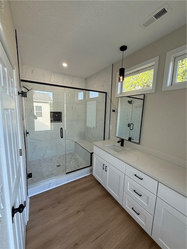 1755 Jason Ave, Norfolk, VA 23509 - bathroom with wood finished floors, a textured ceiling, vanity, a marble finish shower, and recessed lighting