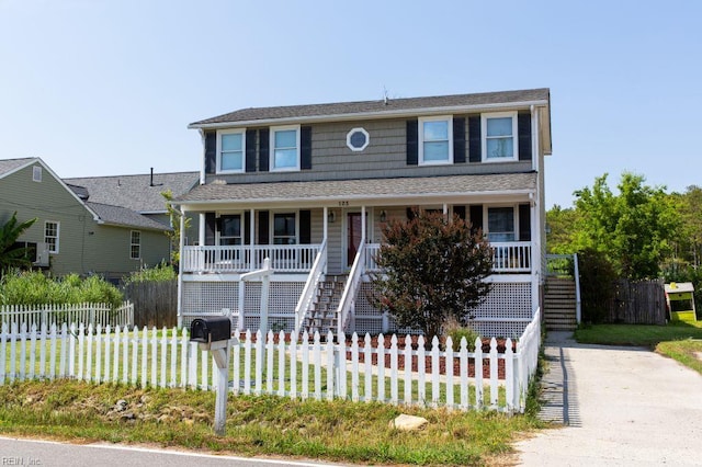 125 Messick Rd, Poquoson, VA 23662 - view of front of property with covered porch, stairway, a fenced front yard, and roof with shingles