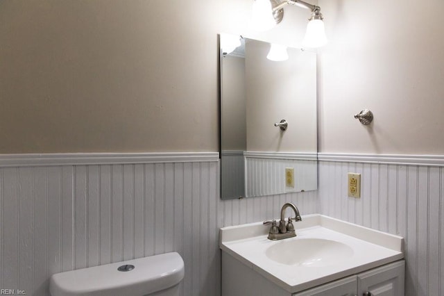 125 Messick Rd, Poquoson, VA 23662 - half bath with a wainscoted wall, toilet, and vanity