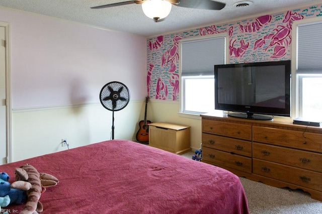 125 Messick Rd, Poquoson, VA 23662 - bedroom featuring multiple windows, wallpapered walls, a textured ceiling, and ceiling fan